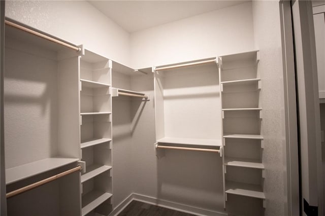 11 Exminster Ln, Bella Vista, AR 72714 - walk in closet featuring dark wood-type flooring