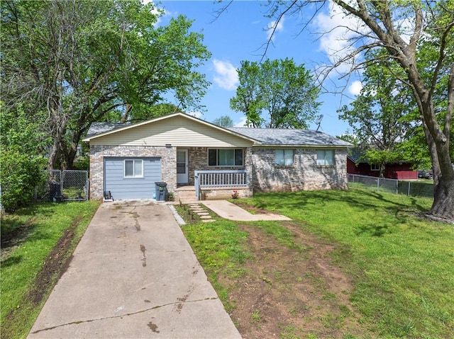 ranch-style home featuring fence, a front yard, brick siding, a porch, and driveway
