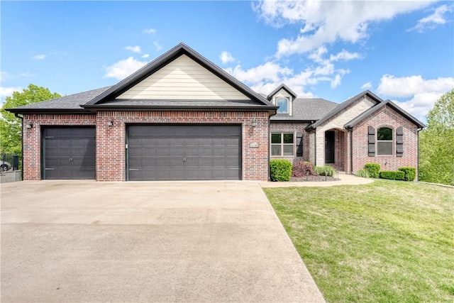 view of front of property featuring an attached garage, concrete driveway, a front lawn, and brick siding
