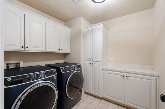 6431 Summer Shade, Van Buren, AR 72956 - laundry area featuring cabinet space, a textured ceiling, washing machine and dryer, and light tile patterned floors