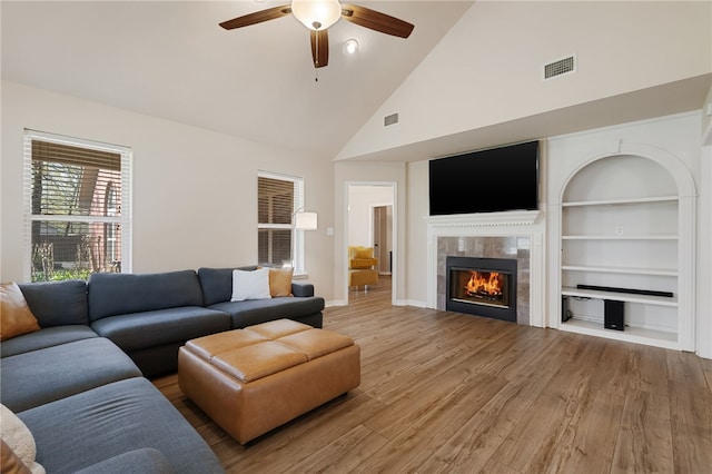 6431 Summer Shade, Van Buren, AR 72956 - living room featuring visible vents, a ceiling fan, a fireplace, and light wood-type flooring