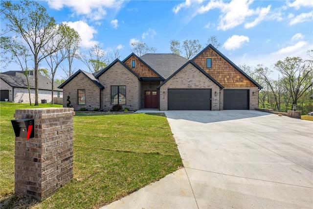 craftsman inspired home with concrete driveway, brick siding, an attached garage, and a front yard