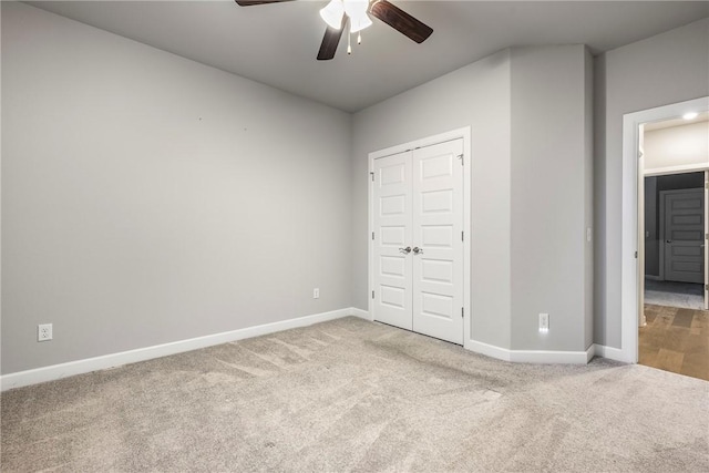 2109 Abbott Ln, Pea Ridge, AR 72751 - unfurnished bedroom featuring carpet flooring, baseboards, a closet, and a ceiling fan