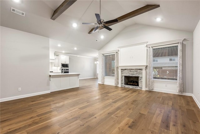 2109 Abbott Ln, Pea Ridge, AR 72751 - unfurnished living room featuring ceiling fan, wood finished floors, recessed lighting, baseboards, and a stone fireplace