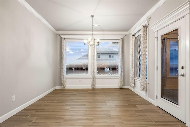 2109 Abbott Ln, Pea Ridge, AR 72751 - unfurnished dining area featuring a chandelier, crown molding, baseboards, and light wood-style flooring