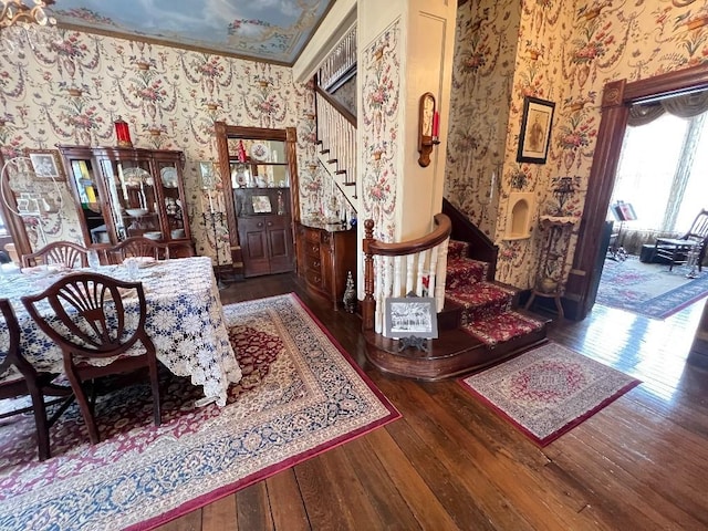 interior space featuring hardwood / wood-style floors, stairway, and wallpapered walls