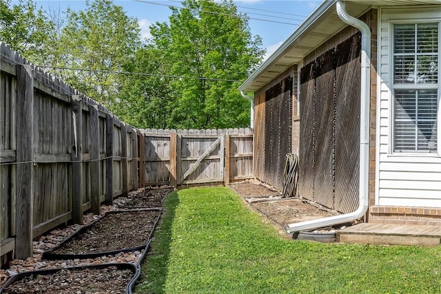 view of yard with a fenced backyard