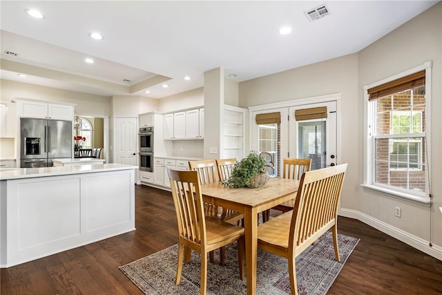 dining space with french doors, visible vents, baseboards, dark wood-type flooring, and recessed lighting