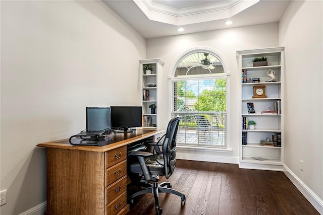 office space with recessed lighting, baseboards, dark wood finished floors, crown molding, and a raised ceiling
