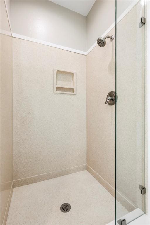 full bath featuring a tile shower