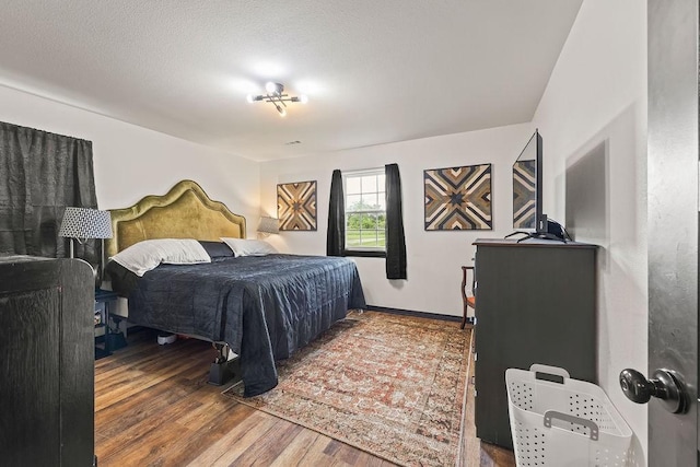 bedroom featuring wood finished floors