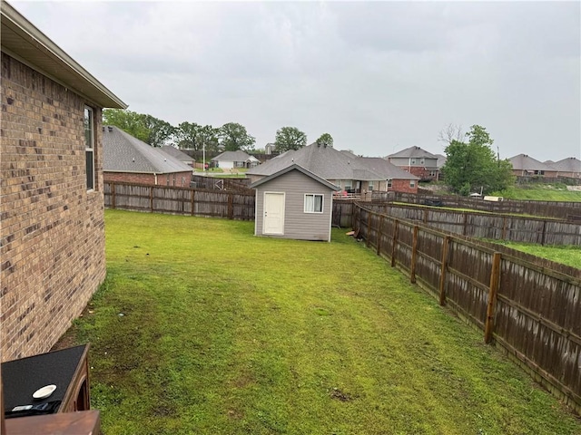 view of yard with a fenced backyard and a residential view