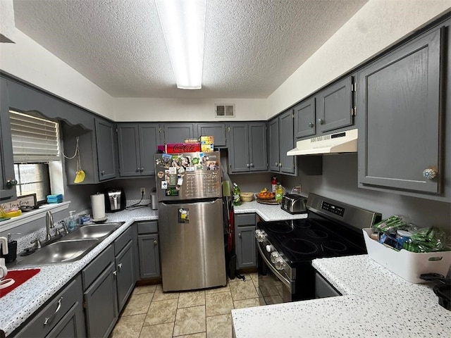 809 Walnut, Dardanelle, AR 72834 - kitchen featuring a sink, appliances with stainless steel finishes, under cabinet range hood, and light countertops