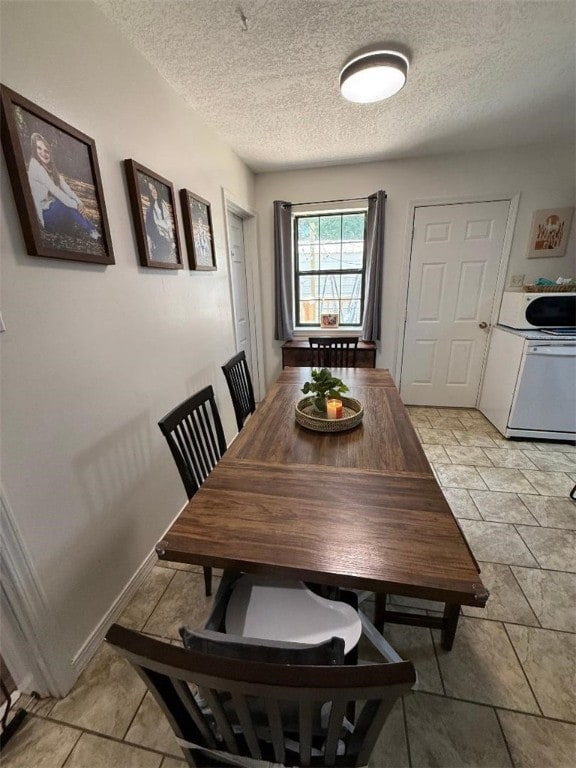 809 Walnut, Dardanelle, AR 72834 - dining space with baseboards and a textured ceiling