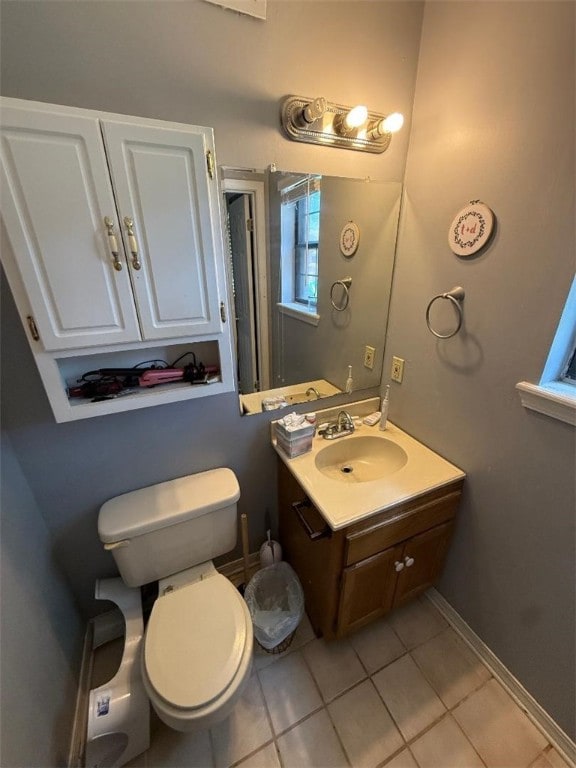 809 Walnut, Dardanelle, AR 72834 - half bathroom featuring vanity, baseboards, tile patterned floors, and toilet