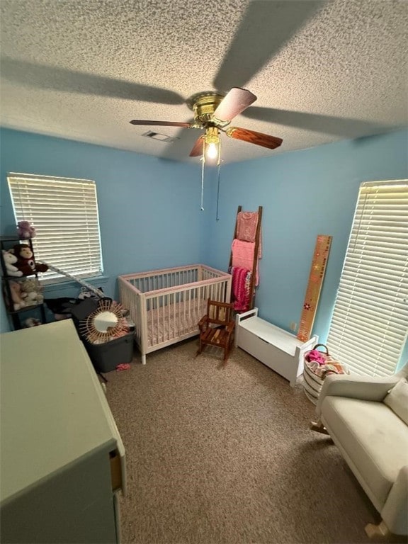 809 Walnut, Dardanelle, AR 72834 - carpeted bedroom with a textured ceiling and ceiling fan