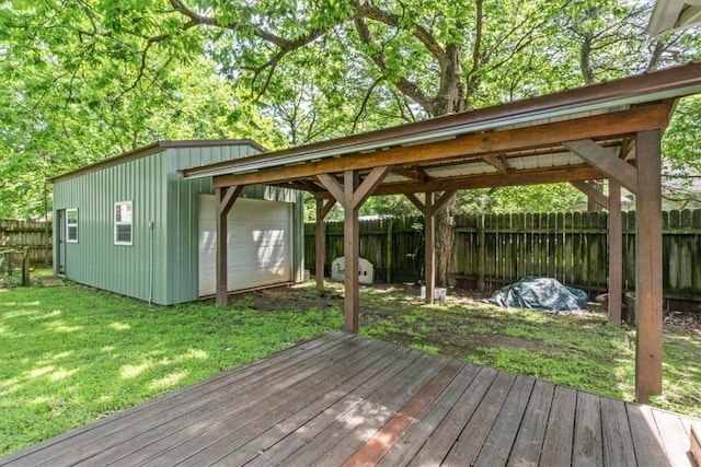 605 N Wright St, Siloam Springs, AR 72761 - wooden terrace with an outdoor structure, a fenced backyard, a lawn, and a detached garage