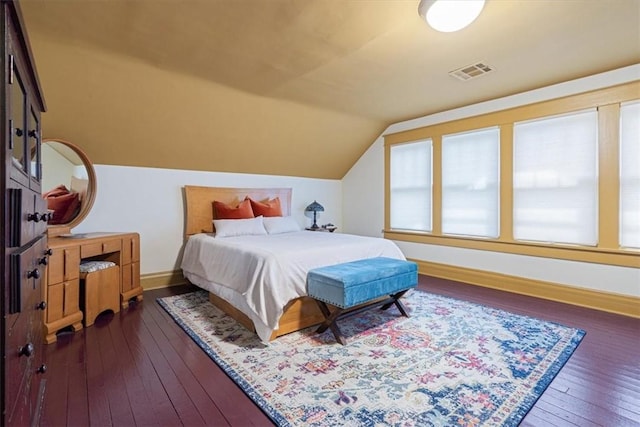 605 N Wright St, Siloam Springs, AR 72761 - bedroom with baseboards, lofted ceiling, dark wood-style floors, and visible vents