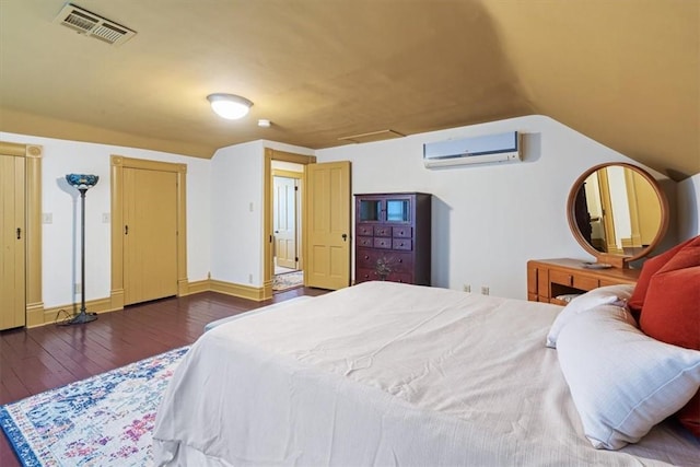 605 N Wright St, Siloam Springs, AR 72761 - bedroom with a wall unit AC, attic access, visible vents, wood-type flooring, and lofted ceiling
