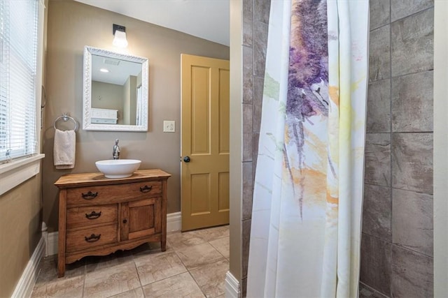 605 N Wright St, Siloam Springs, AR 72761 - bathroom with baseboards, curtained shower, and vanity