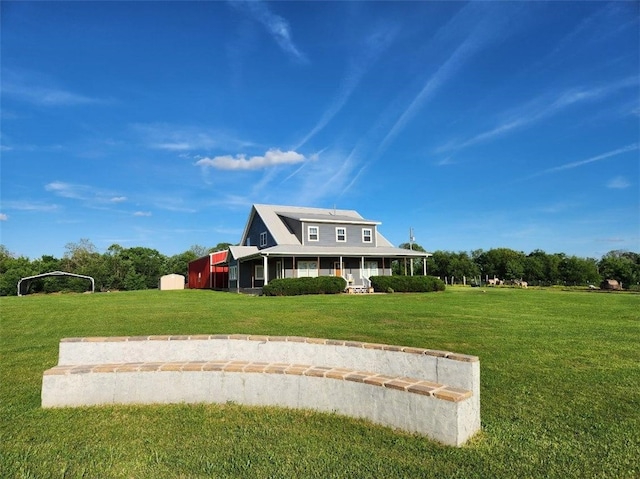 view of front of property featuring a front lawn and covered porch