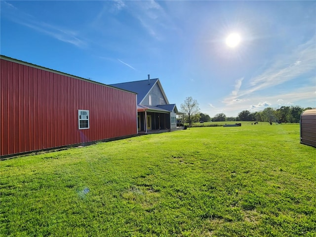 view of yard with an outbuilding and an outdoor structure