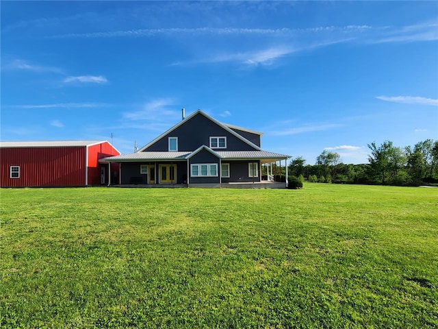 16000 Peterson Rd, Gentry, AR 72734 - back of property featuring a yard, metal roof, a pole building, and an outbuilding
