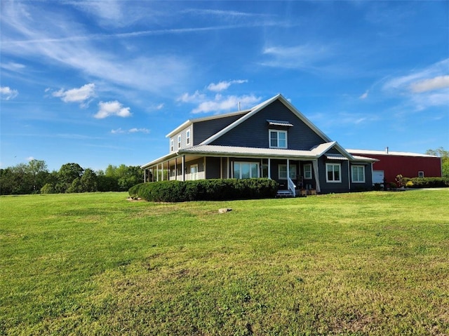 view of front of home with covered porch and a front lawn