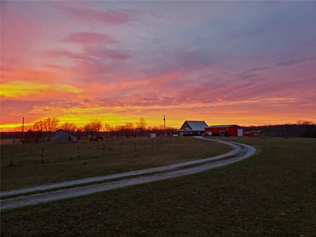 view of road featuring driveway and a rural view