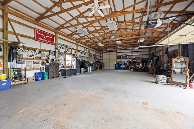 garage with a workshop area and a garage door opener