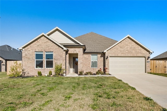 craftsman inspired home featuring fence, an attached garage, brick siding, concrete driveway, and a front yard