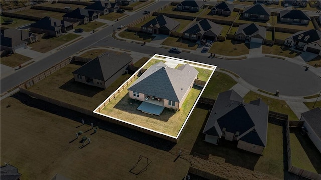 birds eye view of property with a residential view