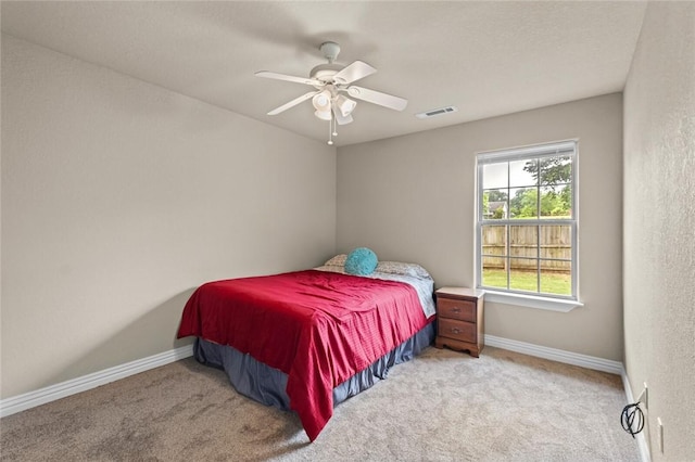 bedroom with carpet floors, baseboards, and ceiling fan