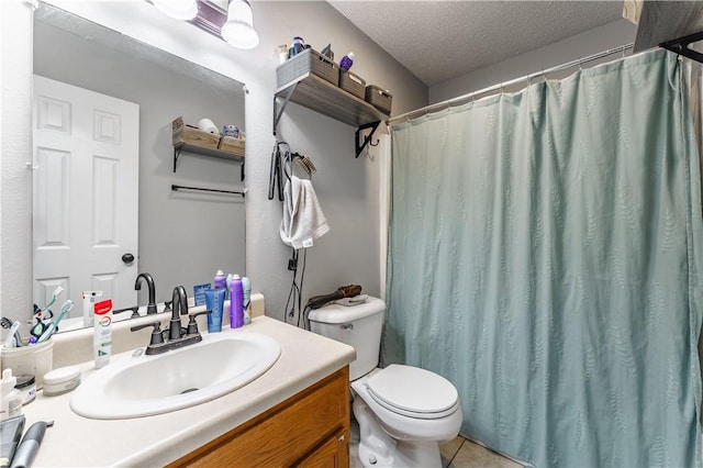 bathroom with toilet, a shower with curtain, a textured ceiling, tile patterned flooring, and vanity