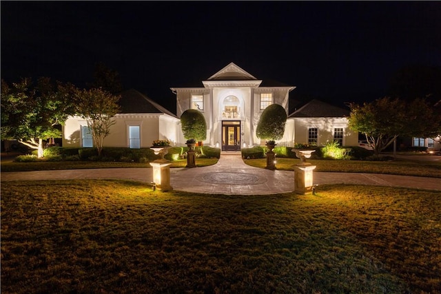 1800 Wheaton Trce, Fort Smith, AR 72908 - neoclassical / greek revival house featuring a lawn, stucco siding, french doors, and curved driveway