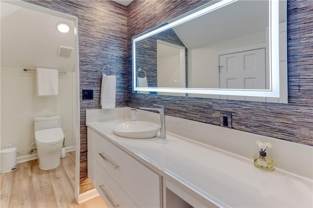 1800 Wheaton Trce, Fort Smith, AR 72908 - bathroom with toilet, vanity, and wood finished floors
