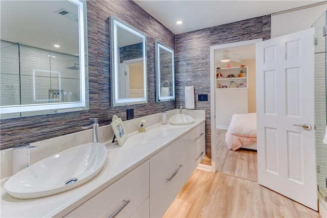 1800 Wheaton Trce, Fort Smith, AR 72908 - full bathroom with a sink, double vanity, visible vents, and wood finished floors