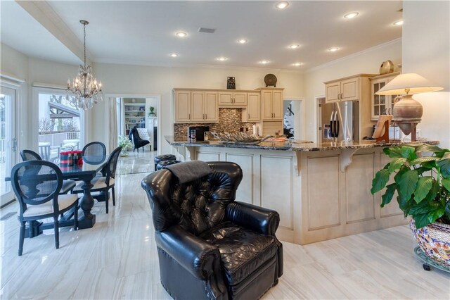1800 Wheaton Trce, Fort Smith, AR 72908 - kitchen featuring a peninsula, an inviting chandelier, decorative backsplash, stone counters, and stainless steel fridge with ice dispenser