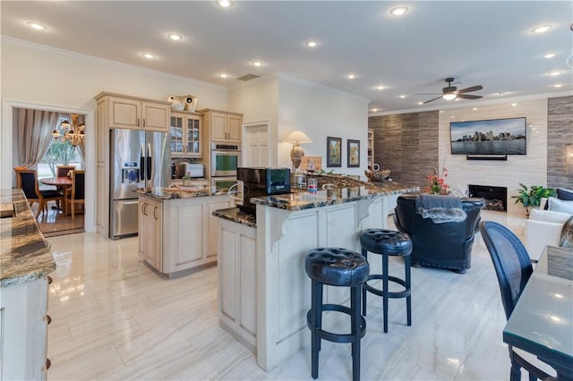 1800 Wheaton Trce, Fort Smith, AR 72908 - kitchen featuring a ceiling fan, ornamental molding, stainless steel fridge with ice dispenser, cream cabinetry, and a kitchen island