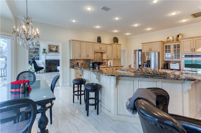 1800 Wheaton Trce, Fort Smith, AR 72908 - kitchen with backsplash, a breakfast bar, ornamental molding, and stainless steel appliances
