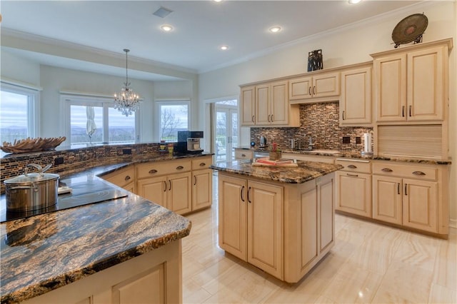 1800 Wheaton Trce, Fort Smith, AR 72908 - kitchen featuring a center island, a notable chandelier, plenty of natural light, decorative backsplash, and black electric stovetop