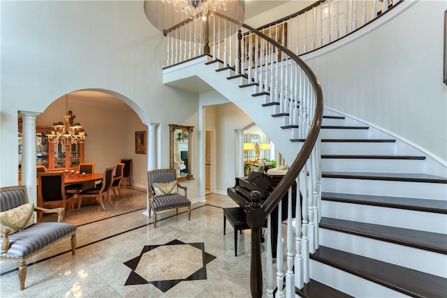 1800 Wheaton Trce, Fort Smith, AR 72908 - stairway featuring arched walkways, ornate columns, a chandelier, and a towering ceiling