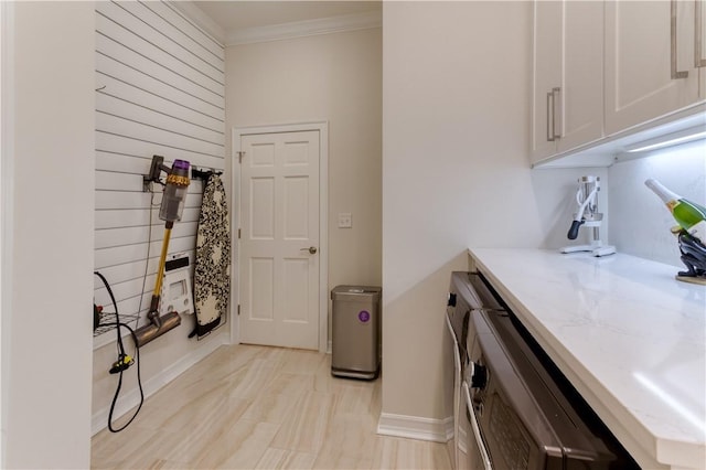 1800 Wheaton Trce, Fort Smith, AR 72908 - laundry room featuring crown molding and baseboards