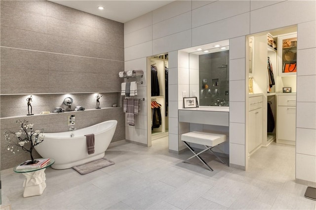 1800 Wheaton Trce, Fort Smith, AR 72908 - full bathroom with tile walls, recessed lighting, a freestanding bath, a shower, and a spacious closet