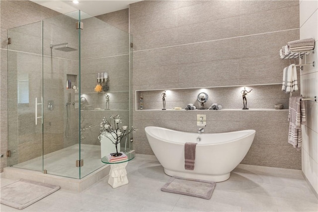 1800 Wheaton Trce, Fort Smith, AR 72908 - bathroom with a shower stall, tile walls, tile patterned flooring, and a freestanding bath