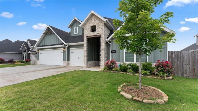 view of front of property featuring board and batten siding, stone siding, driveway, and an attached garage