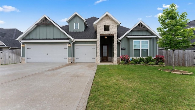 view of front facade with board and batten siding, stone siding, driveway, and a garage