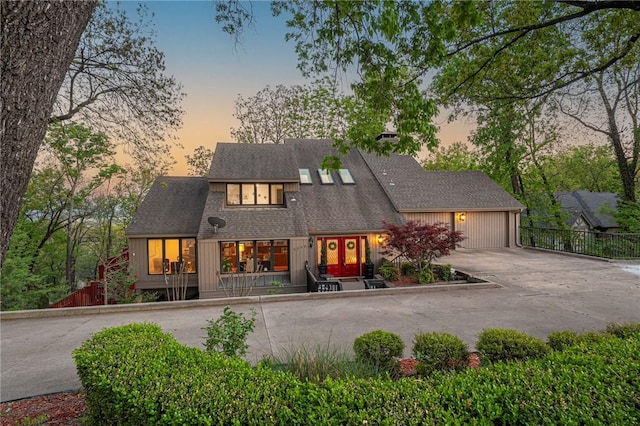 5008 Cliff Dr, Fort Smith, AR 72903 - view of front of home featuring concrete driveway, fence, an attached garage, and roof with shingles