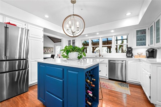 5008 Cliff Dr, Fort Smith, AR 72903 - kitchen with appliances with stainless steel finishes, healthy amount of natural light, white cabinetry, a chandelier, and recessed lighting