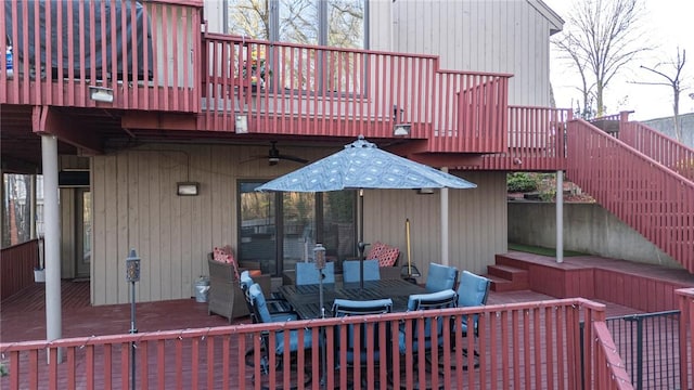 5008 Cliff Dr, Fort Smith, AR 72903 - wooden deck with stairway, ceiling fan, a patio area, and outdoor dining space
